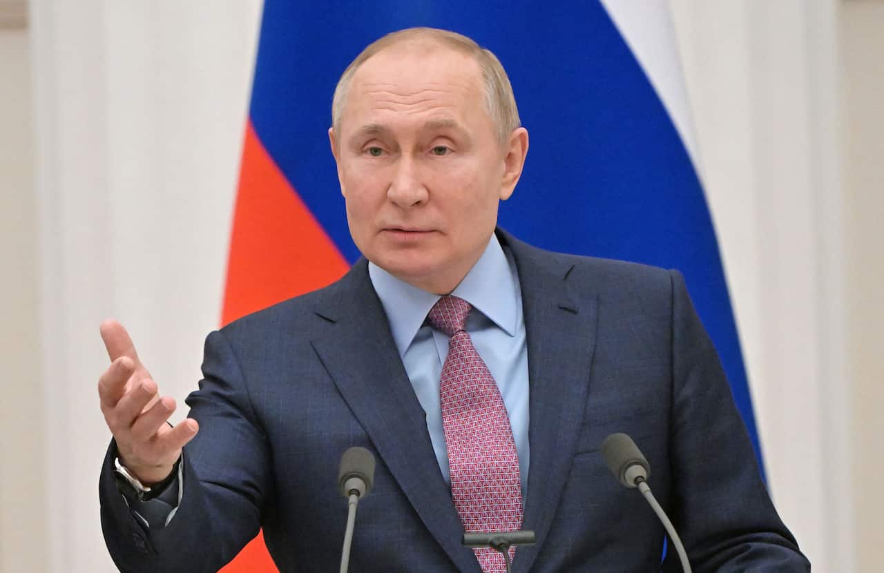 Russia's President Vladimir Putin gestures as he speaks during a press conference.