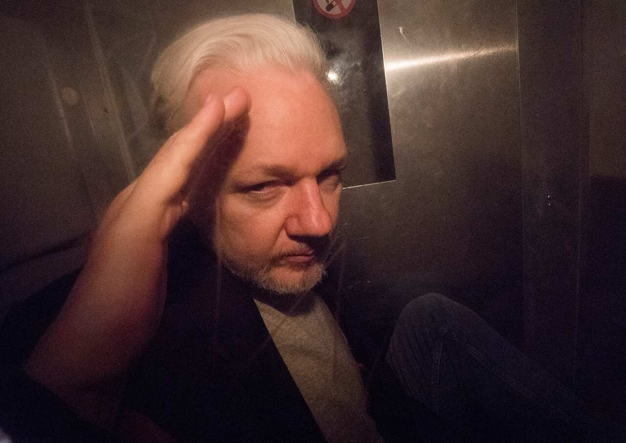 Julian Assange inside a prison van.