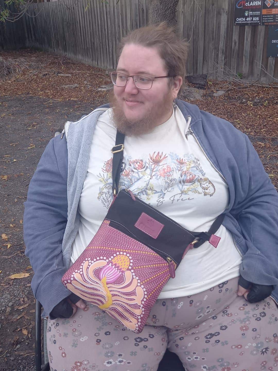 Bram McPartlan in a wheelchair outside.