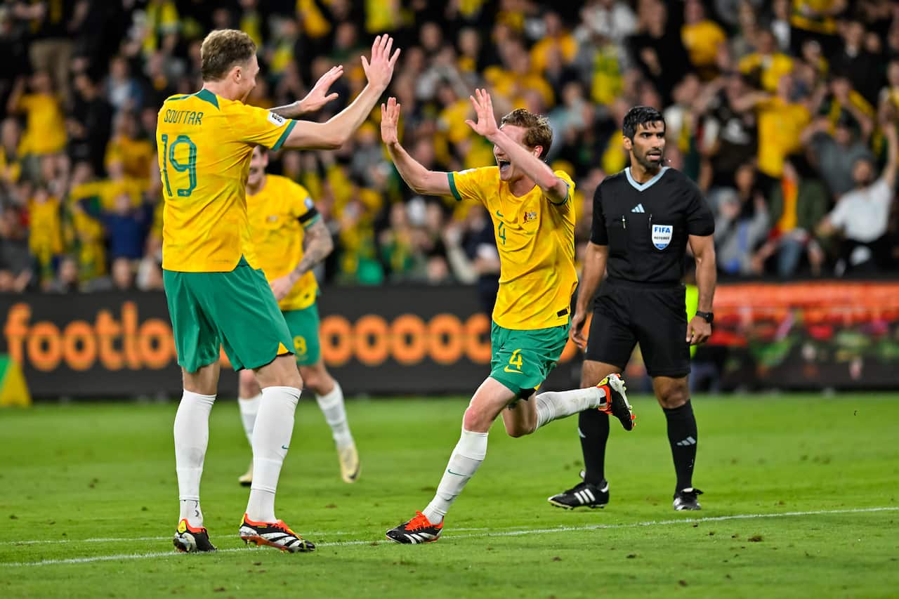 FIFA World Cup 2026 Qualifier Australia v Lebanon at Parramatta Stadium. Two players high five.
