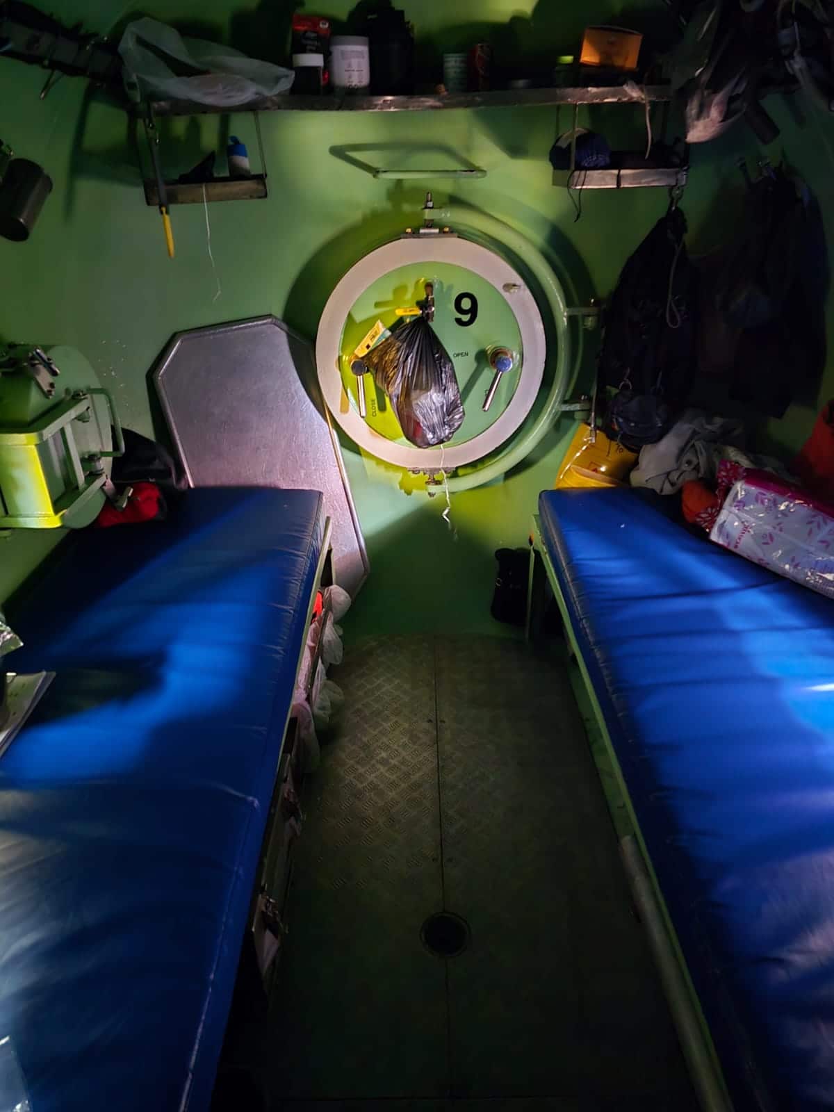 Two bunks in a compact living chamber.