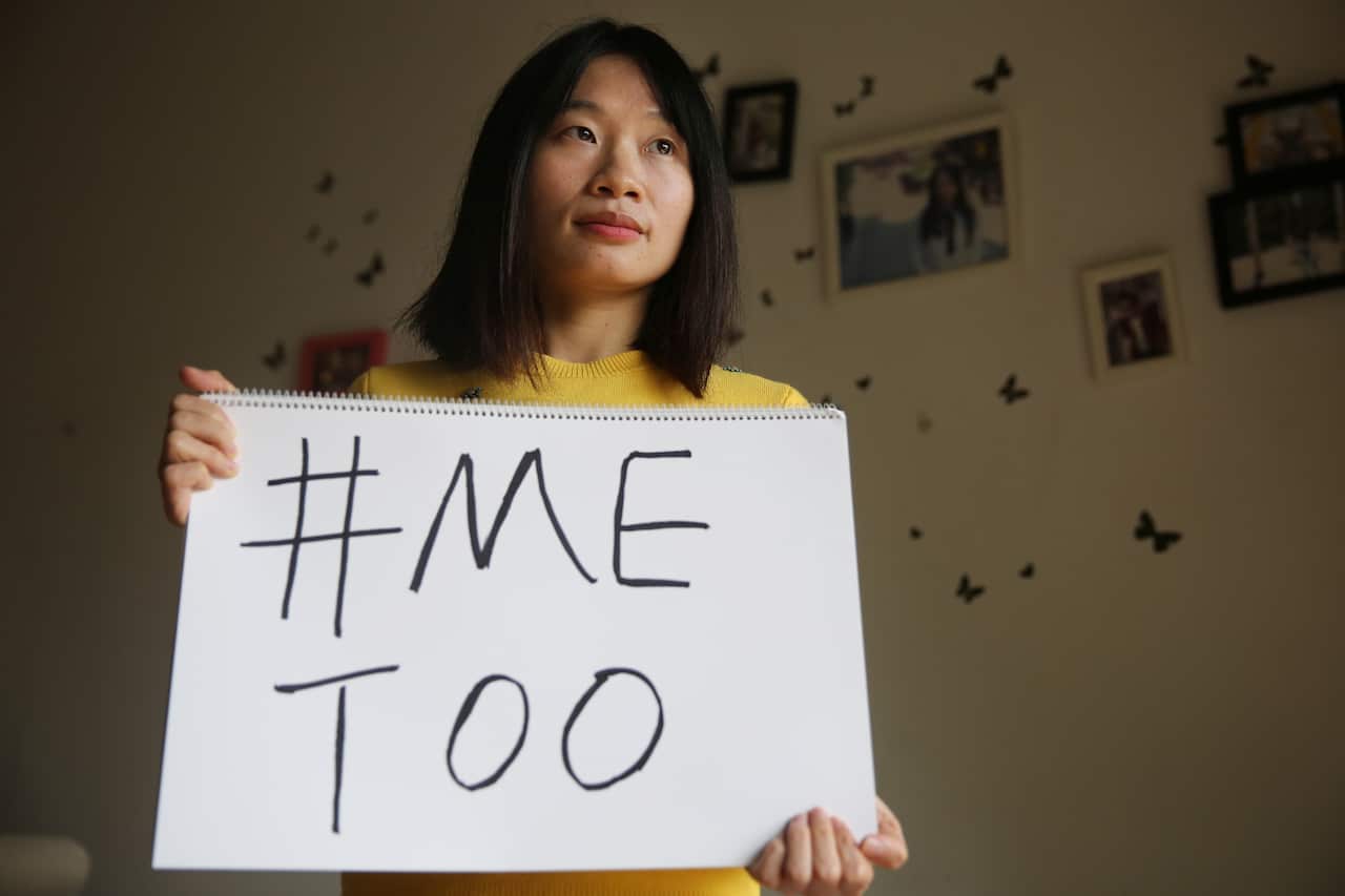 Sophia Huang Xueqin, a freelance journalist who wants to raise peopleé??s awareness on sexual harassment in China, poses with a #MeToo sign at her home. 08DEC17 SCMP/Thomas Yau