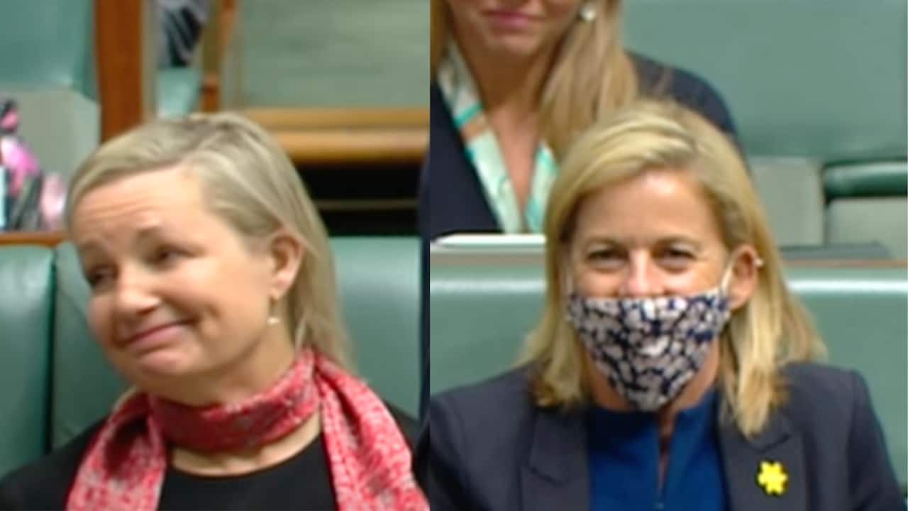 Two blonde women look bemsued. 