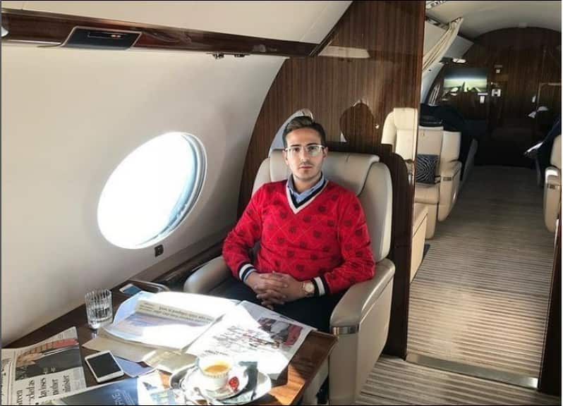 Hayut wearing designer clothing on a private plane.