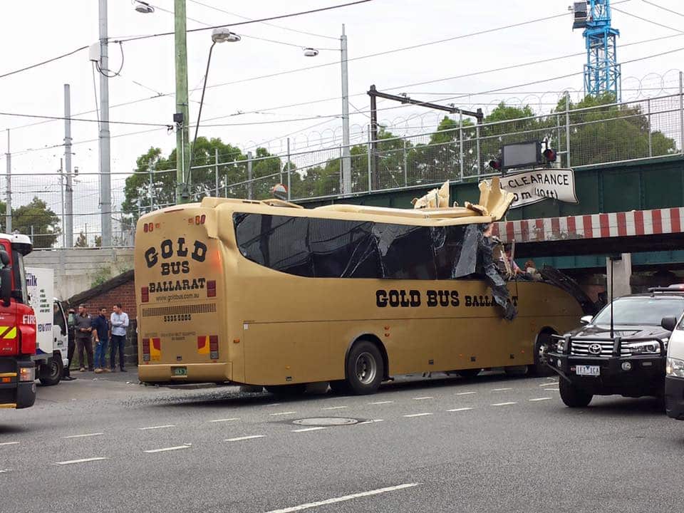 Bus collides with bridge. 