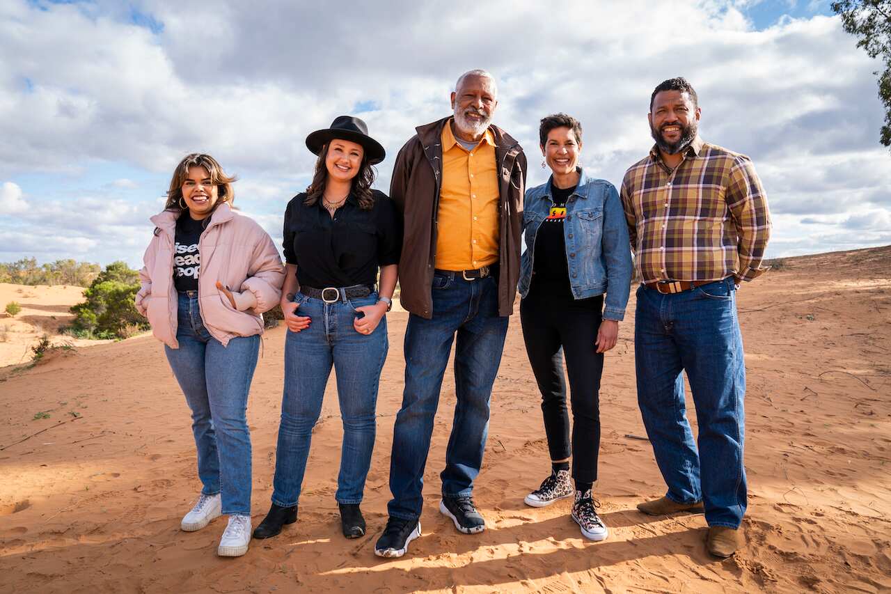 Bianca Hunt, Rae Johnston, Ernie Dingo, Narelda Jacobs and Aaron Fa’Aoso stand together in the Australian desert, as co-hosts of 'Going Places With Ernie Dingo' season 5.jpeg