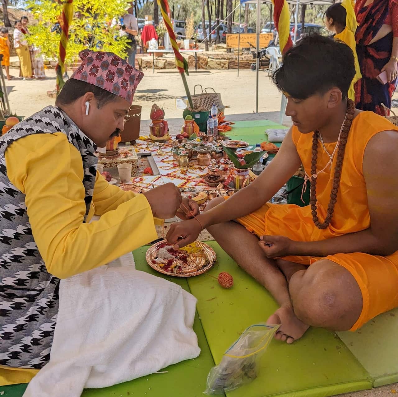 Priest Shankar Prasad Gautam (L) and Rhyan Bidur Singh (R) performing bratabandha rituals.