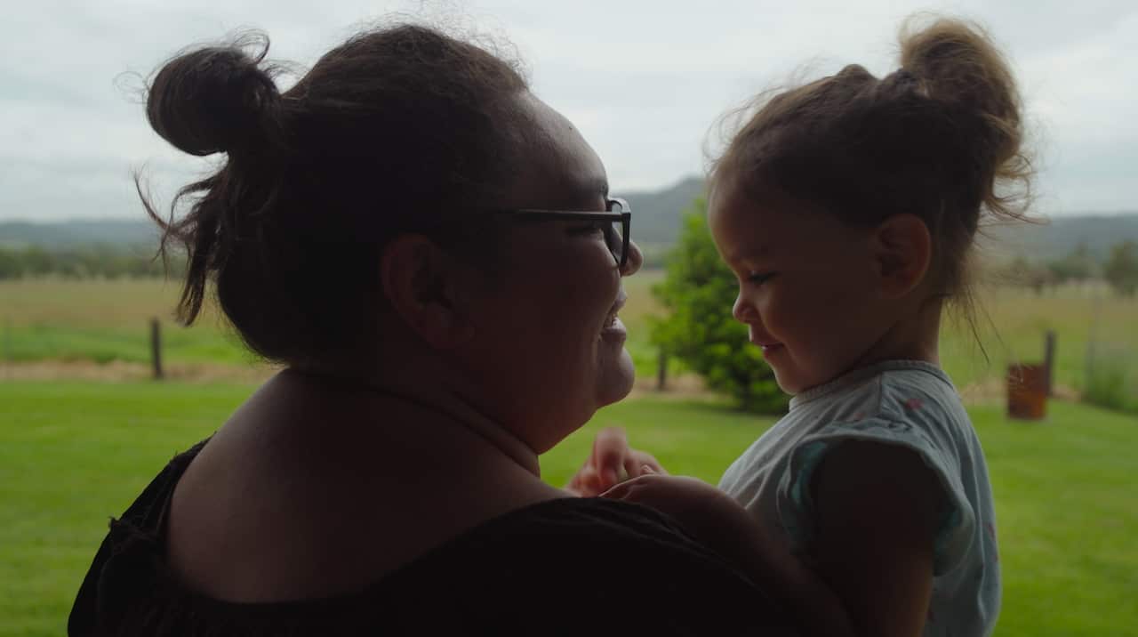 Honey Tawhai with her daughter.png