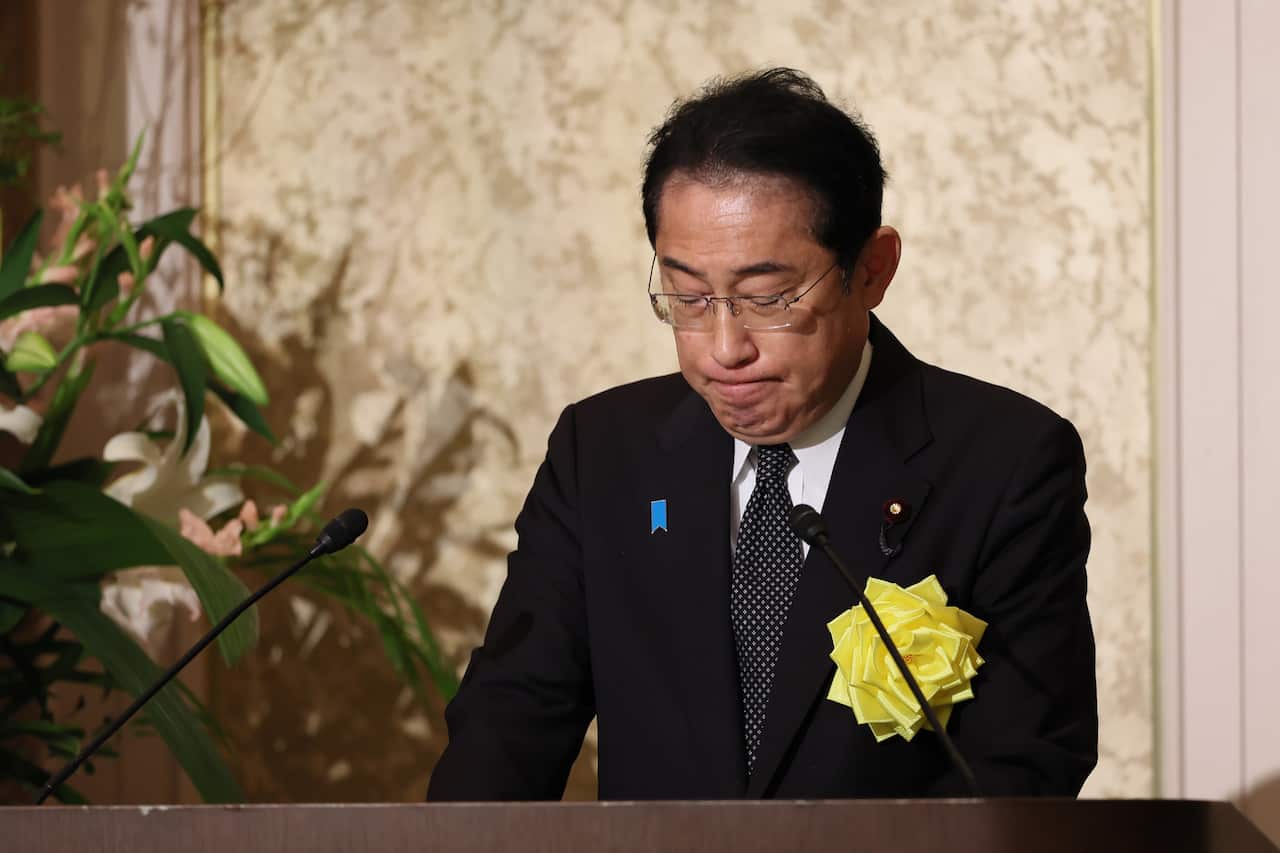 A man speaks at a memorial.