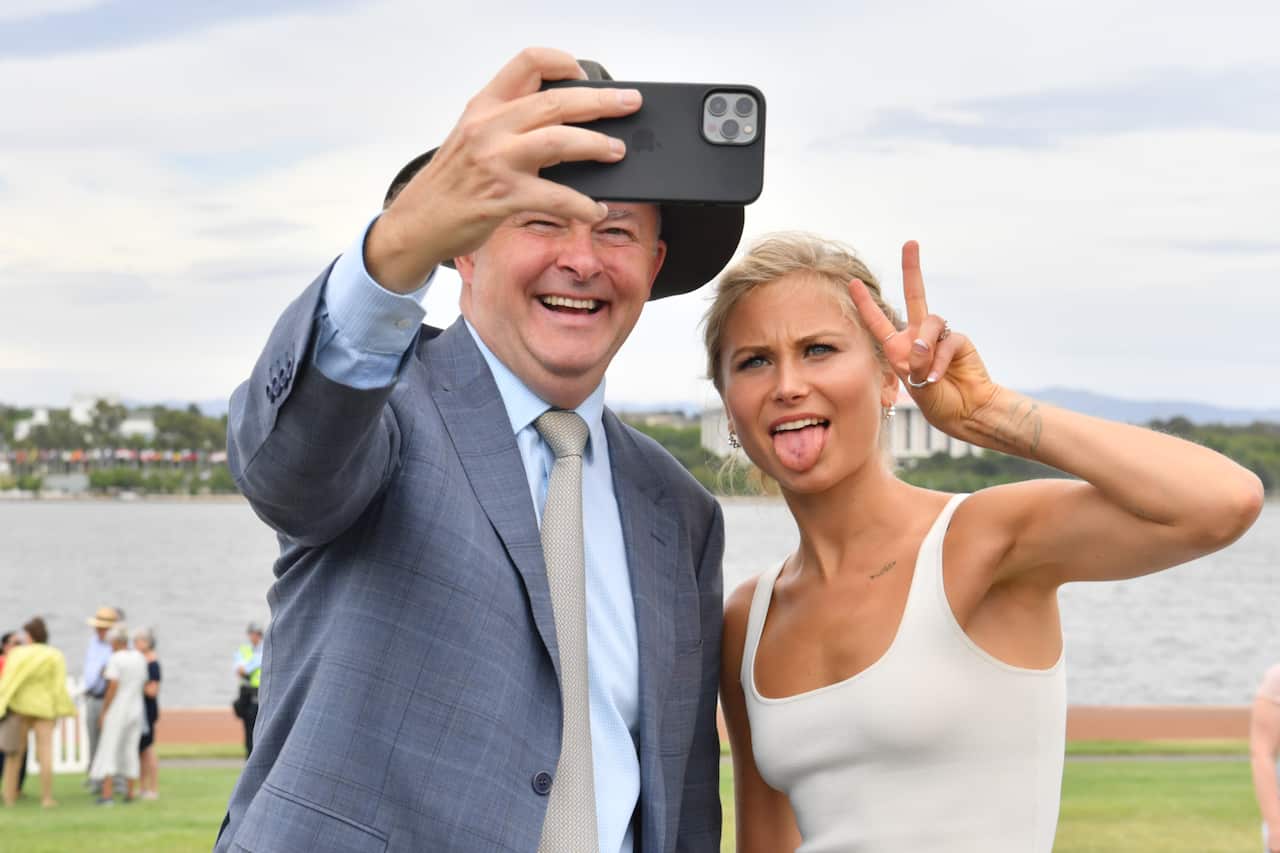Leader of the Opposition Anthony Albanese and 2021 Australian of the Year Grace Tame take a selfie.