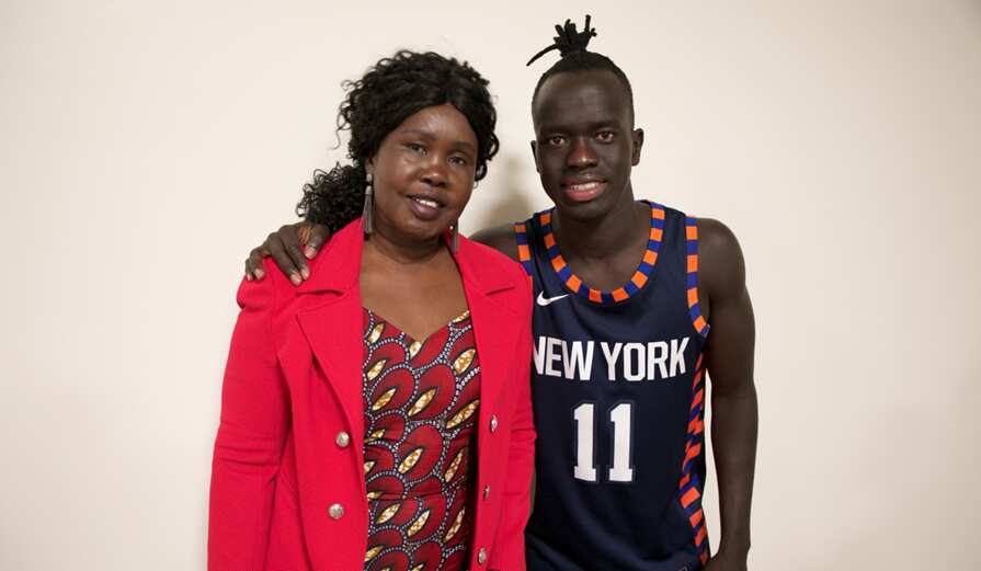 Awer Mabil and his mother Agot-mayom Dau 