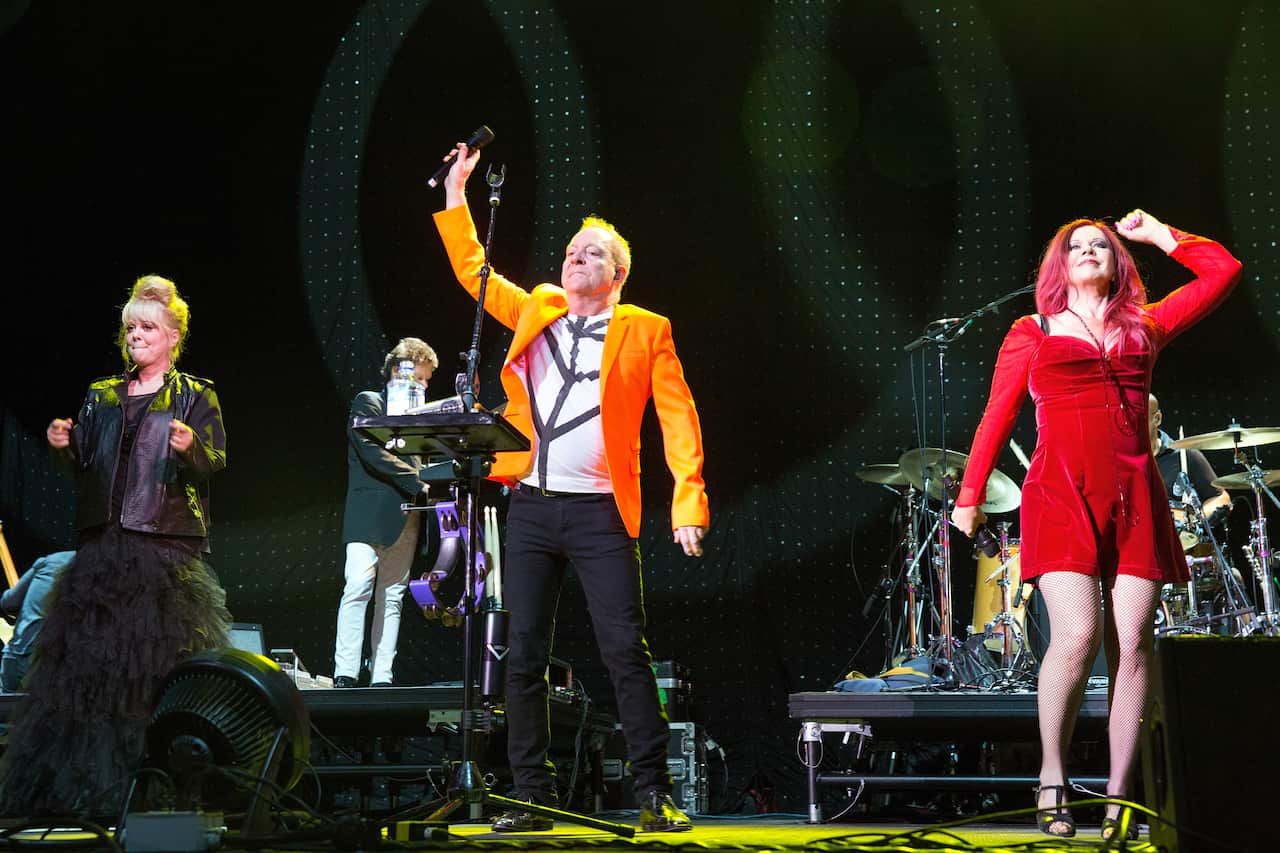The B-52s performing on stage.