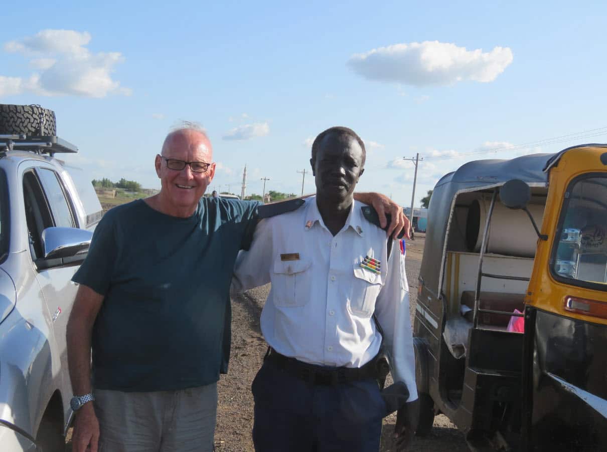 two men with their arms around each other