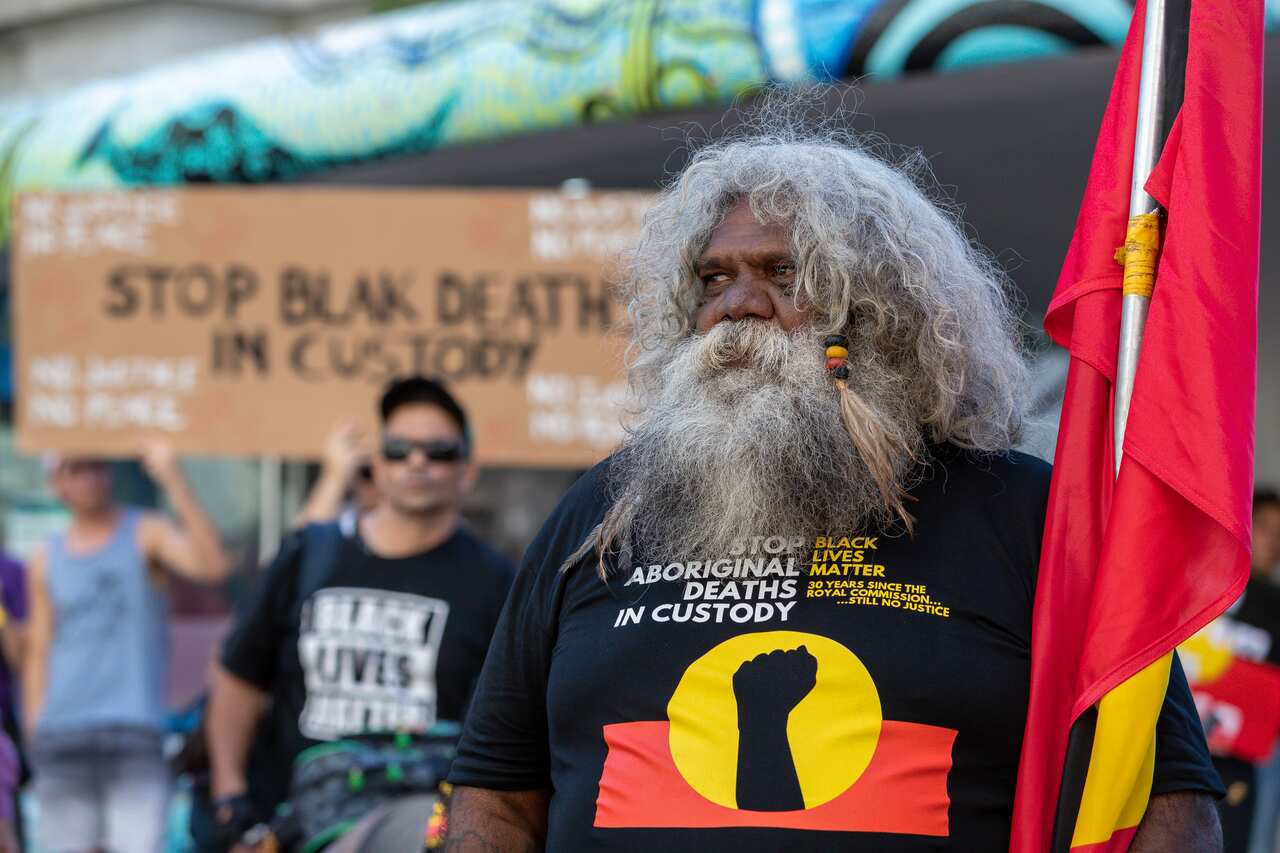 Protesters at a rally marking the 30th anniversary of the Royal Commission into Aboriginal Deaths in Custody.
