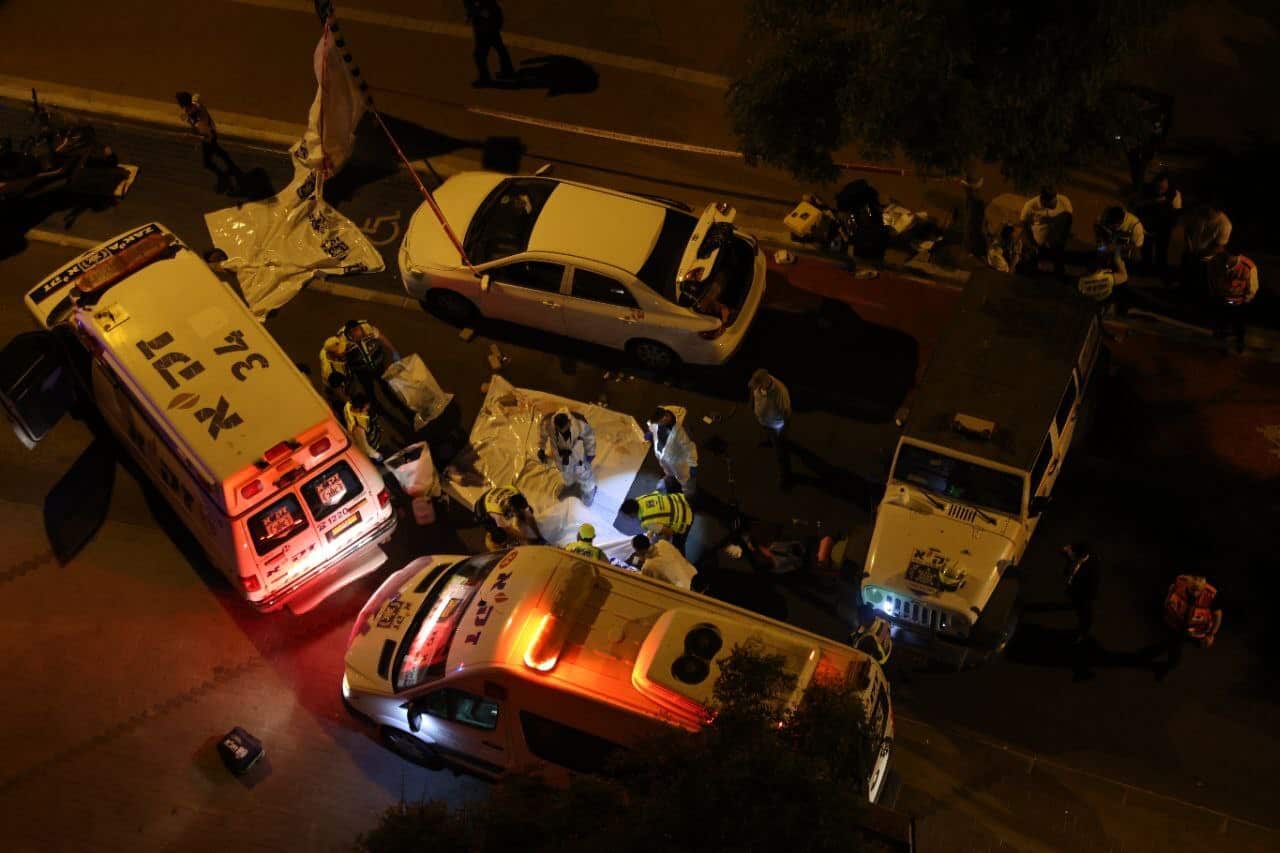 Aerial view of ambulances and medics at the scene of a stabbing attack,