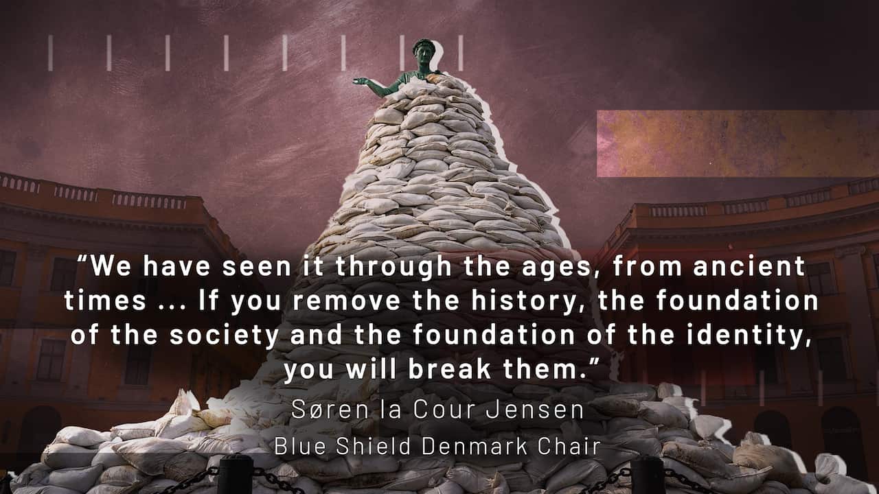 Sandbags around a statue.