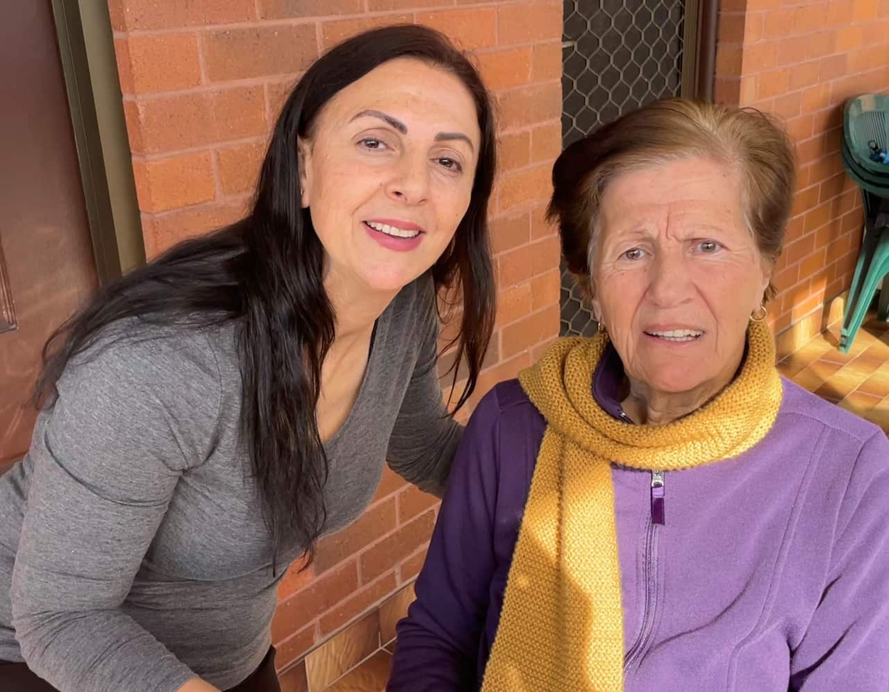 Julie El Bayeh stands next to her mother, Nadia