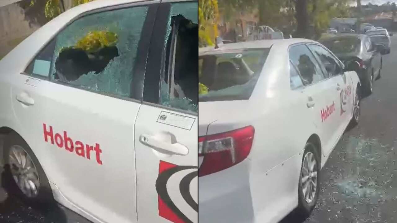 Composite image of a taxi with windows smashed out