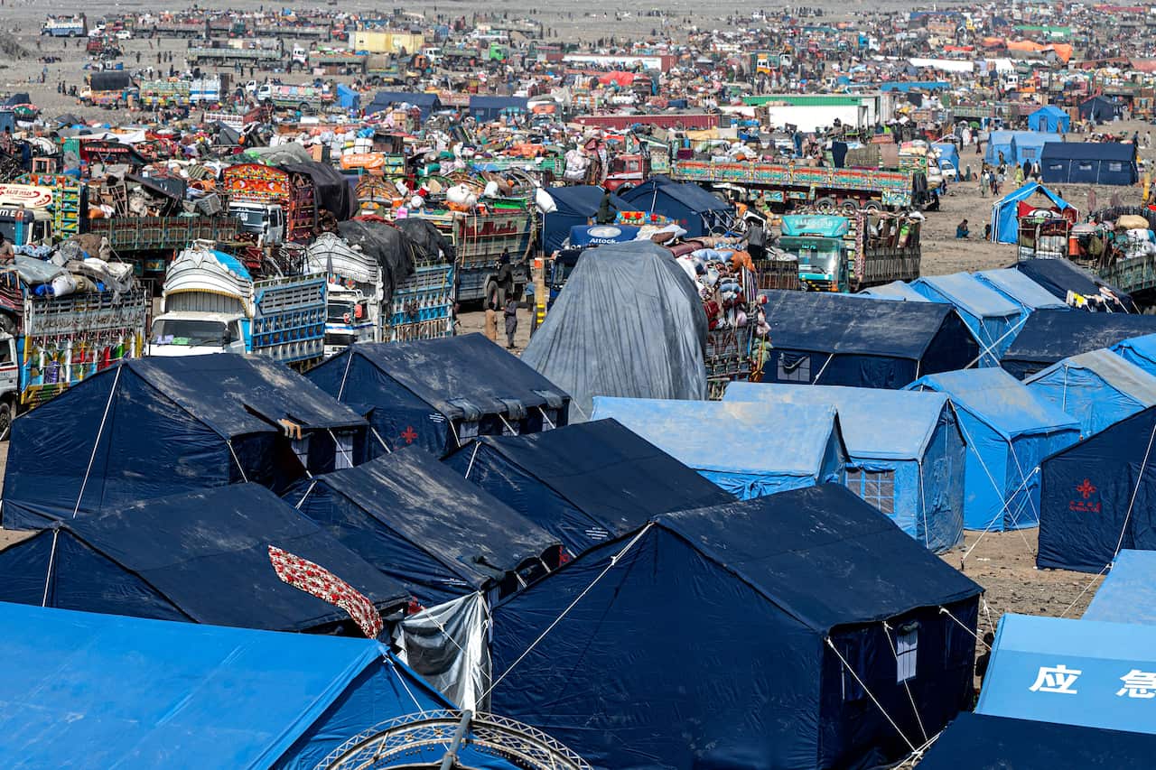 Light blue and dark blue tents outside 