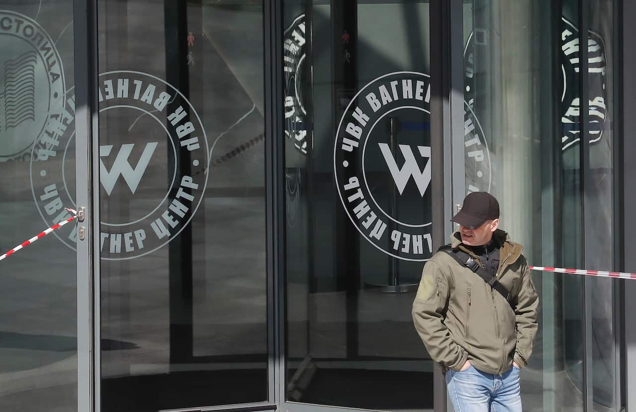 A man standing outside a building.