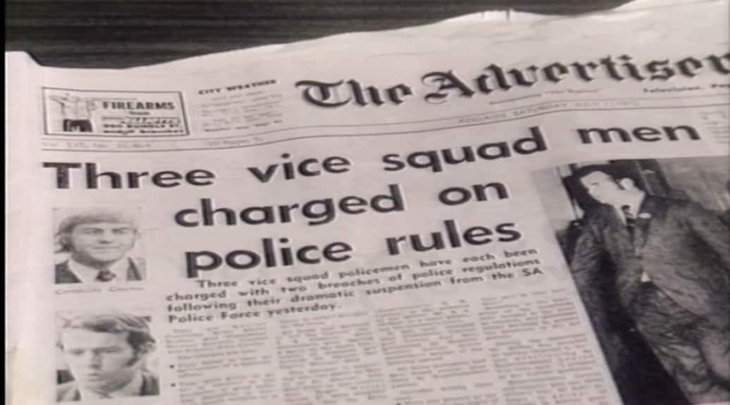 A photo of a black and white newspaper reading 'Three vice squad men charged on police rules'