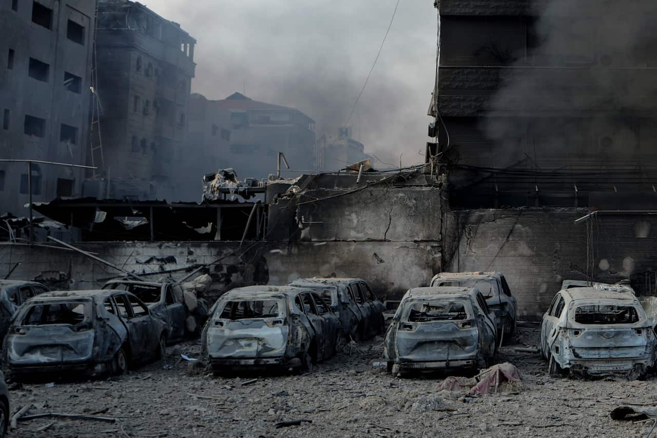 Charred cars at the site of an airstrike.