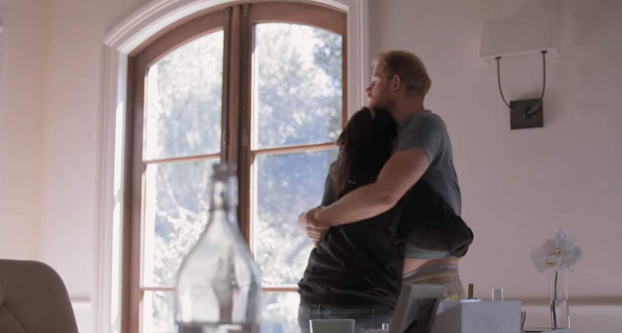 A man and woman hugging. 