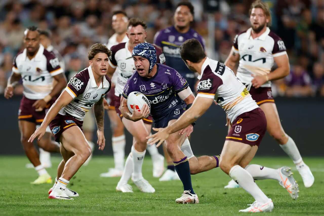 Jahrome Hughes makes a break to score a try for the Storm..jpg