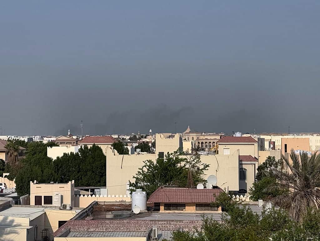 Black smoke billows from a residential compound in the Qatari capital of Doha.