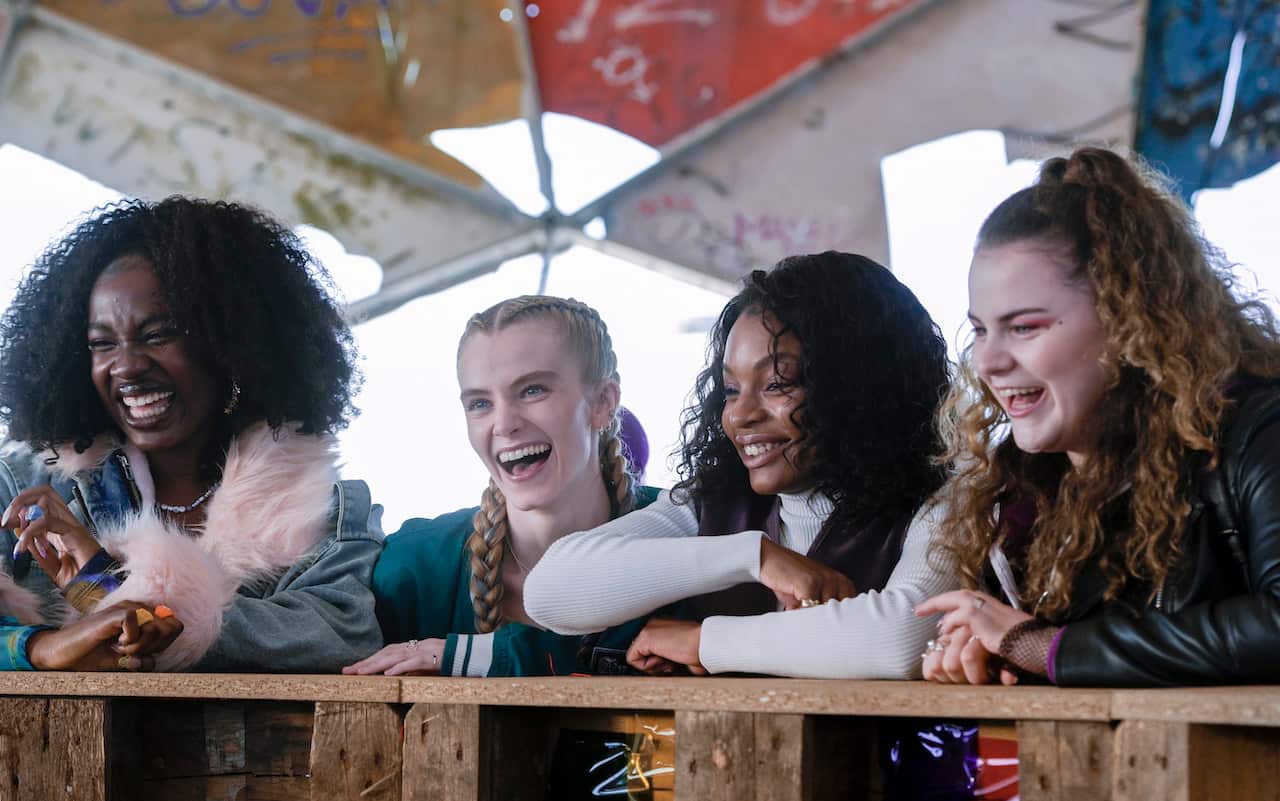 Four young women (Yasmin Monet Prince, Leah McNamara, Vivian Oparah and Isidora Fairhurst) stand side by side laughing in UK series Then You Run