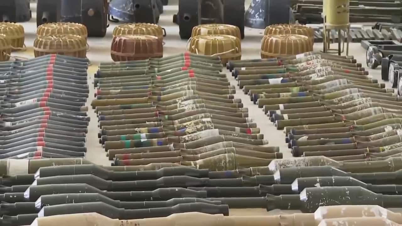 Weapons laid out on a table.