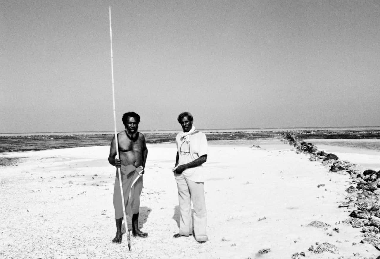 Eddie Mabo (left) and Jack Wailu standing outside