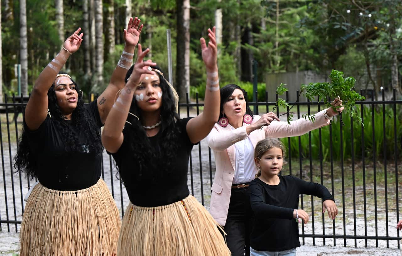 People dance in traditional dresses.