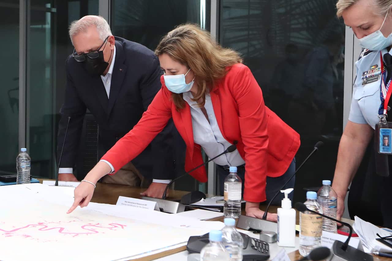 Prime Minister Scott Morrison with Queensland Premier Annastacia Palaszczuk at the Kedron Emergency Services complex in Brisbane, Queensland.