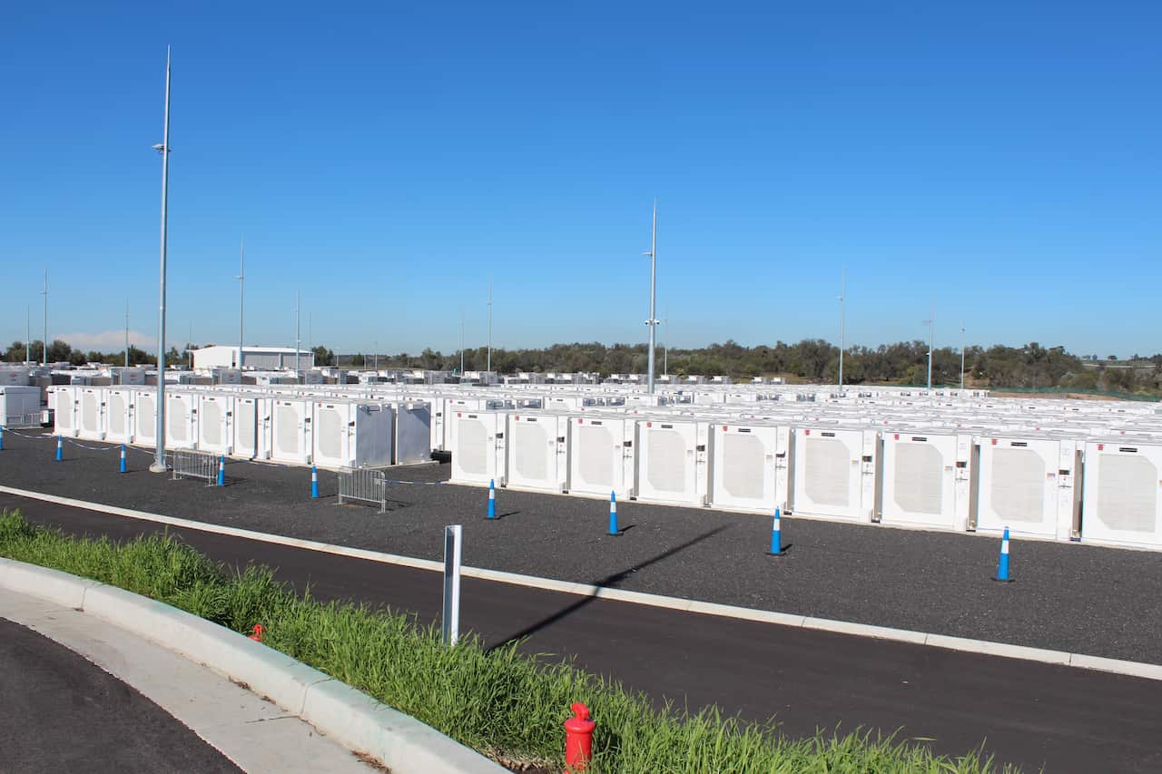 Low rows of white cabinets with blue witches hats around them