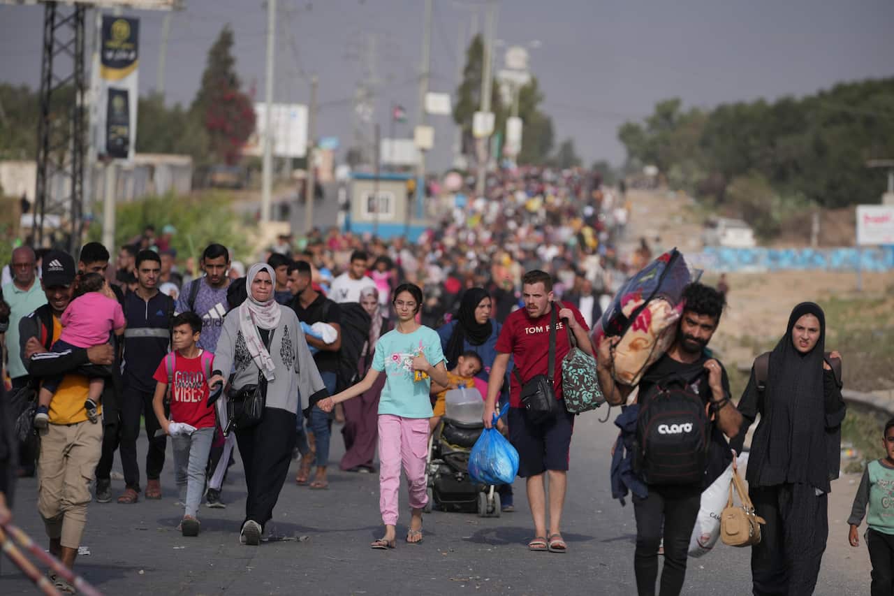 Civilians walking towards southern Gaza strip.