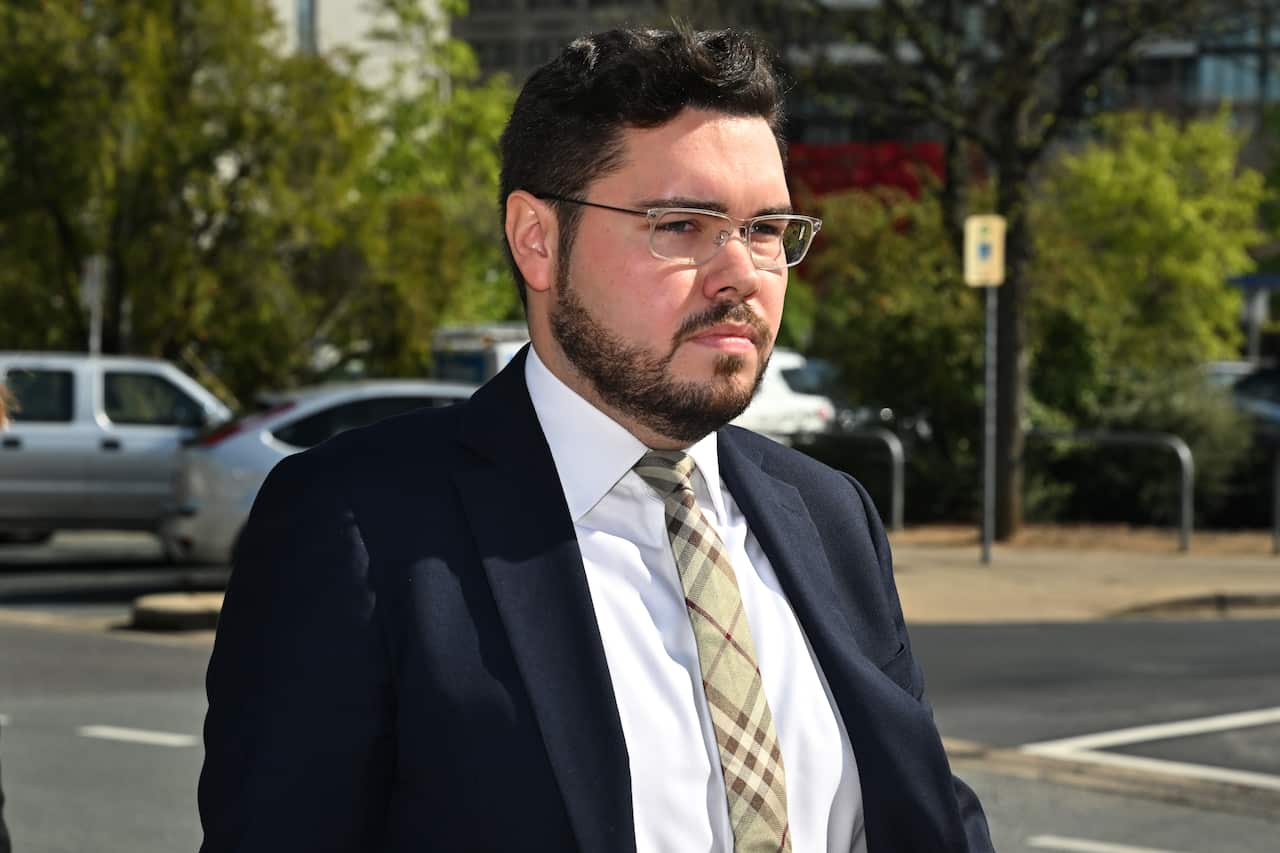 Bruce Lehrmann, a man wearing a suit, tie and glasses, arrives at the ACT Supreme Court.
