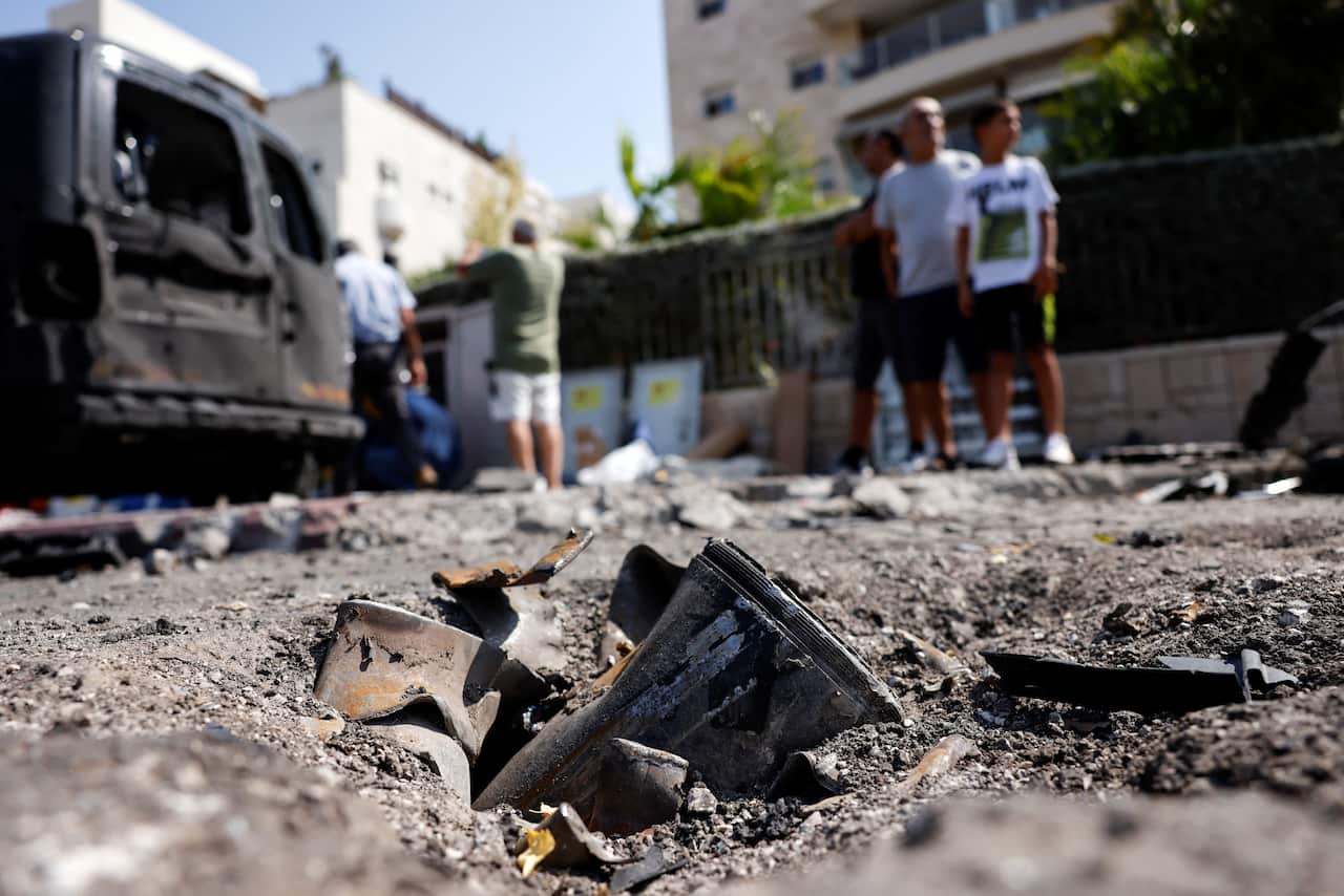 The remains of a rocket fired from the Gaza Strip into Israel lies on a road where it fell in Ashkelon, southern Israel
