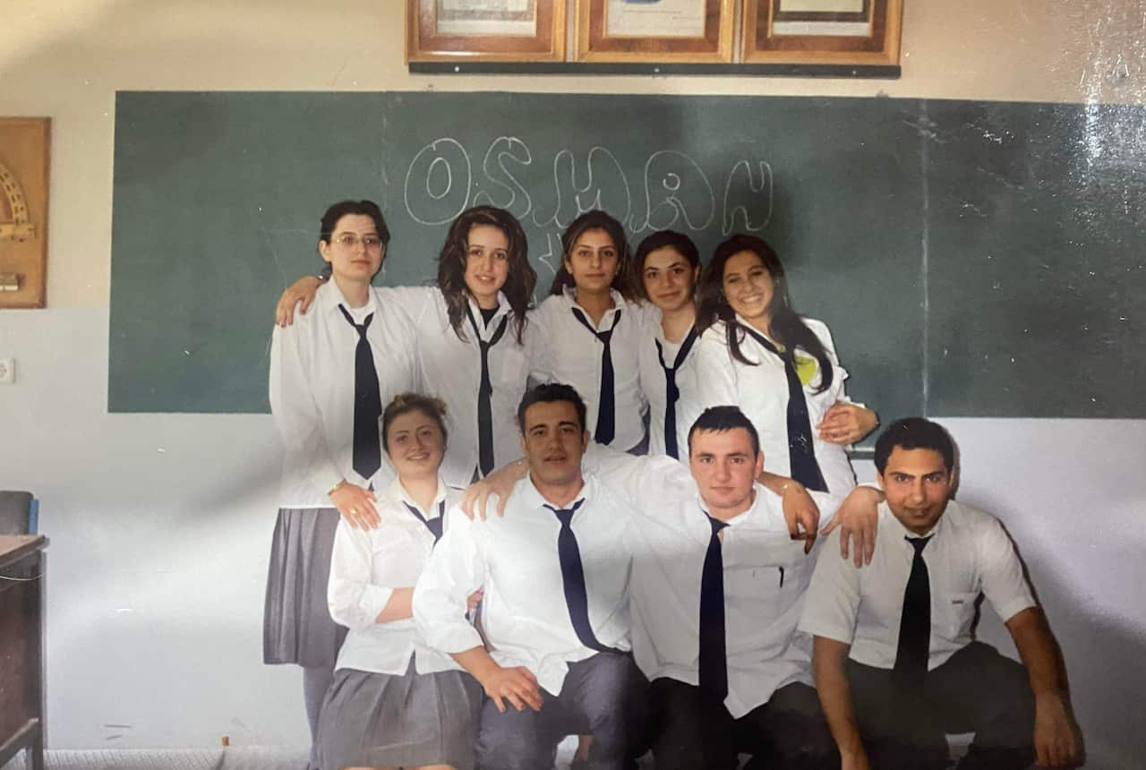 Group of school students in a classroom. 