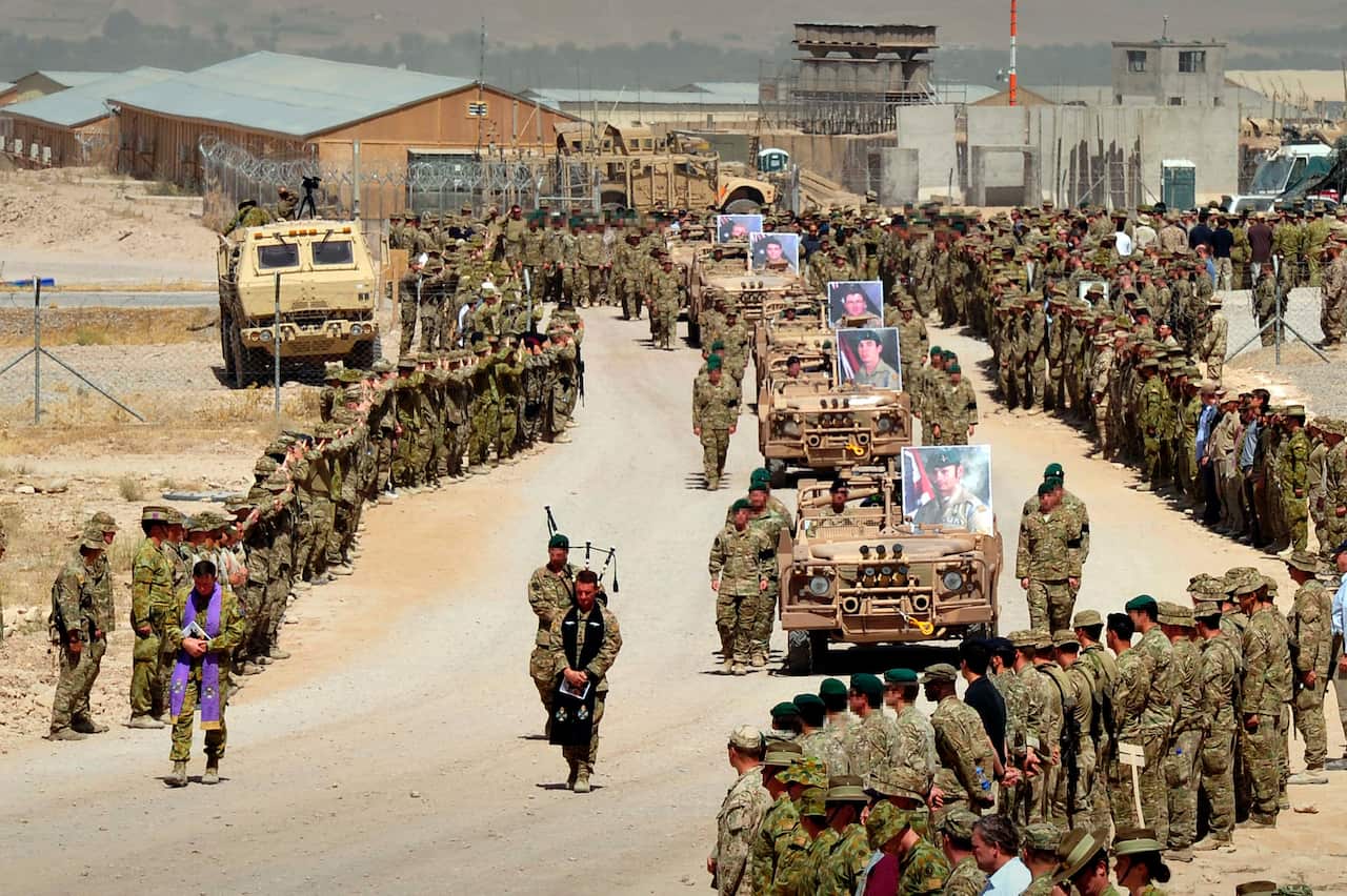 Sept. 2, 2012; Long Range Patrol Vehicles carry five fallen Australian soldiers to the C-130 Aircraft that will carry them on their last journey home from Tarin Kowt, Afghanistan to Australia.