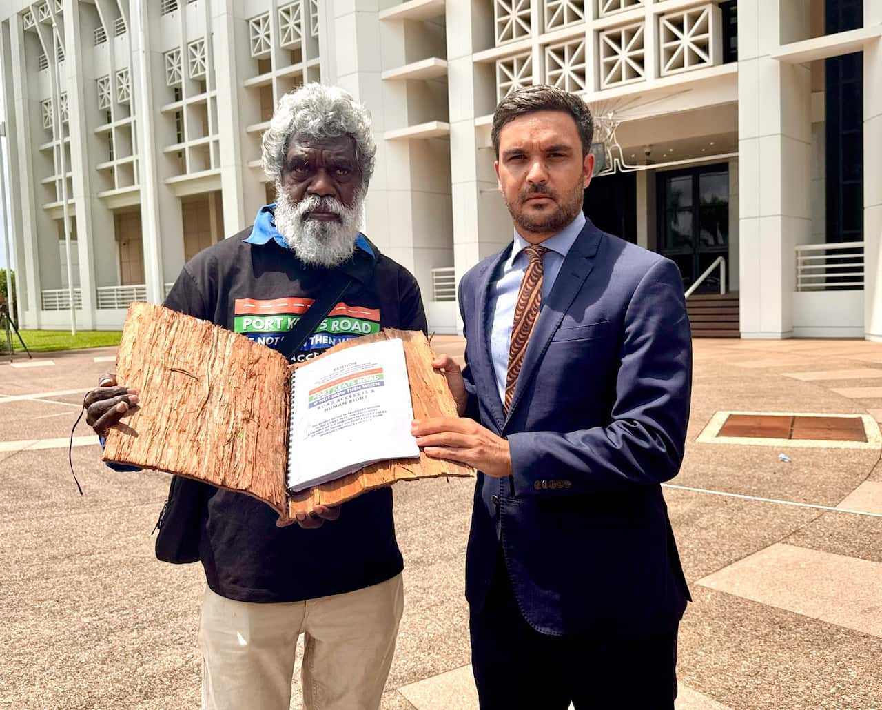 William Parmbuk handed the petition to member for Daly Dheran Young. 