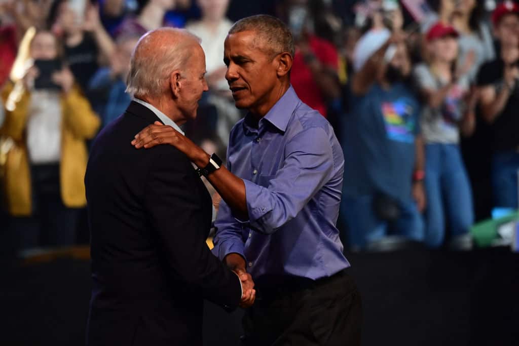 US President Joe Biden (L) and former president Barack Obama (R).