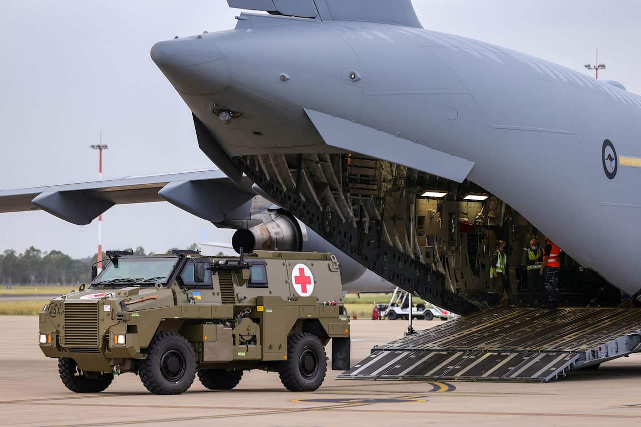 A Bushmaster PMV is loaded into a C-17 Globemaster ready for transport to the Ukraine on 8 April 2022.  