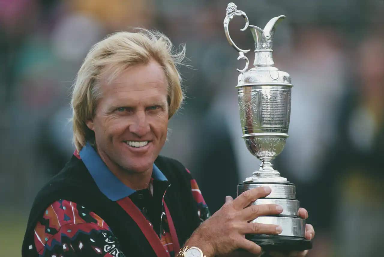 Greg Norman holds his second Claret Jug after winning the 122nd British Open Championship in 1993.