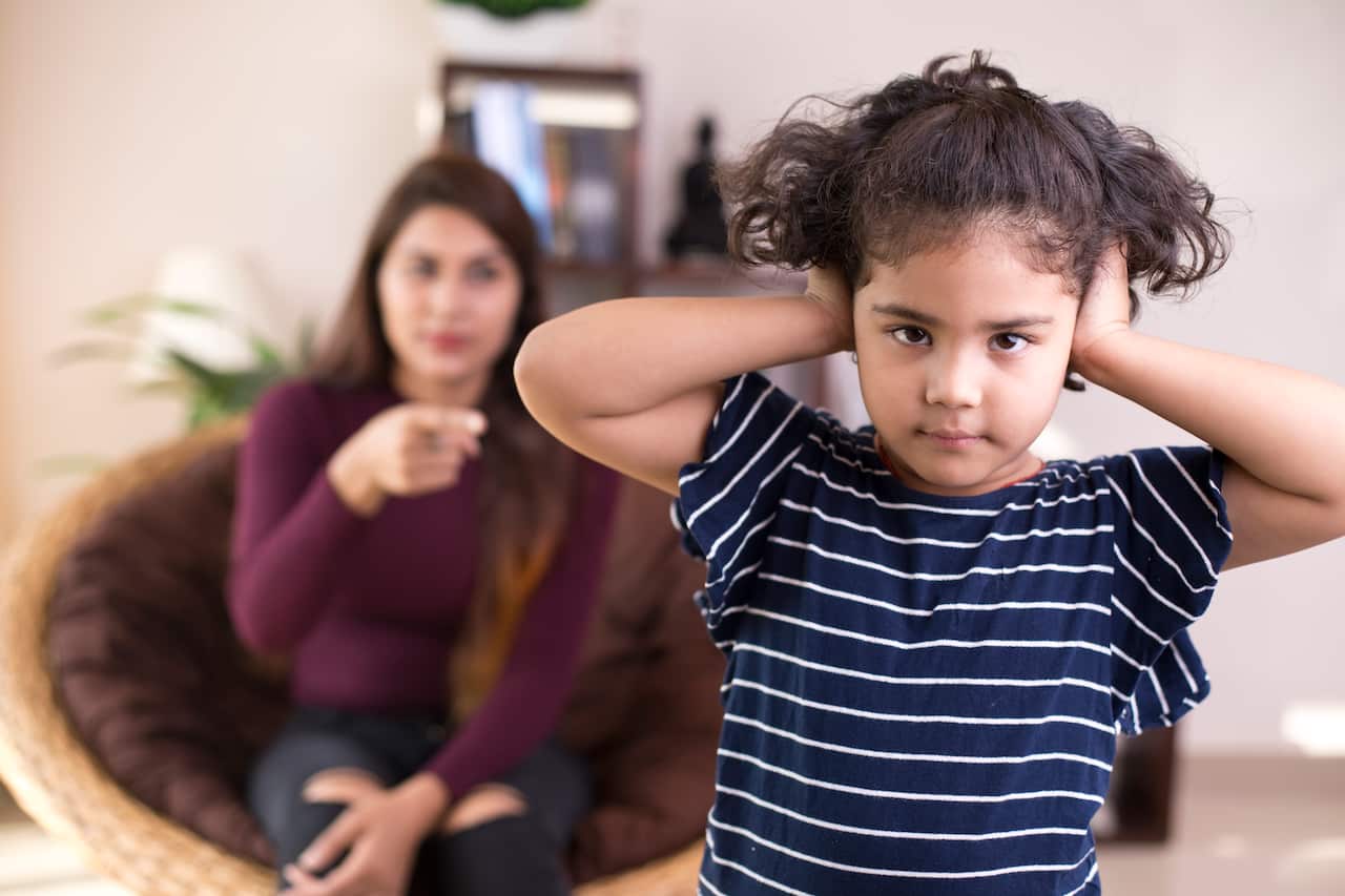 Mother scolding her daughter