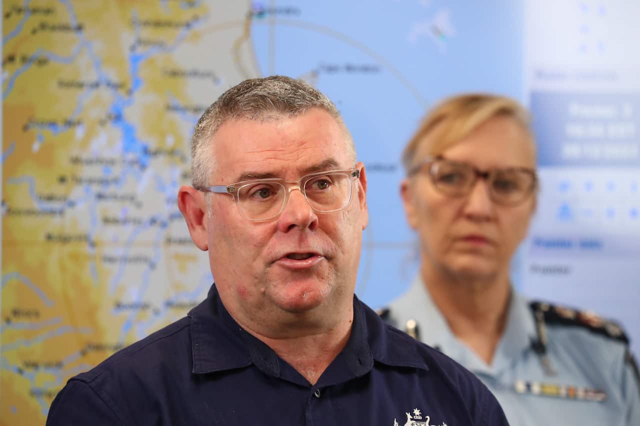 The man in official uniform speaking at the press conference.