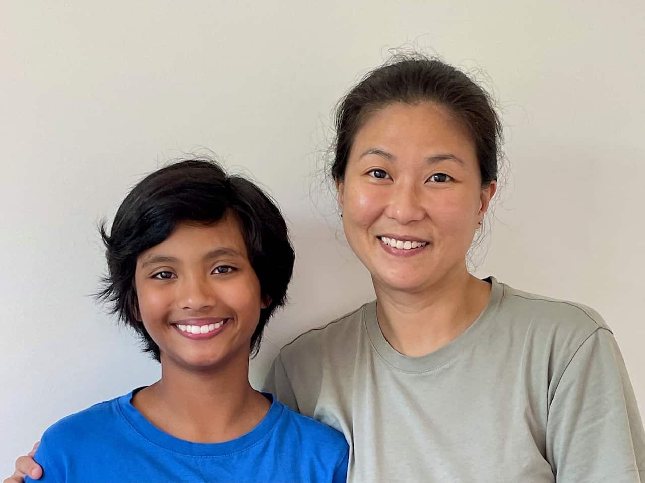 A Chinese woman hugs her daughter