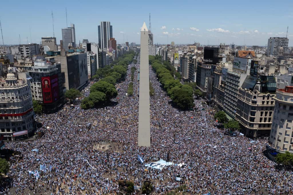 Aerial view of huge crowd of people in city streets