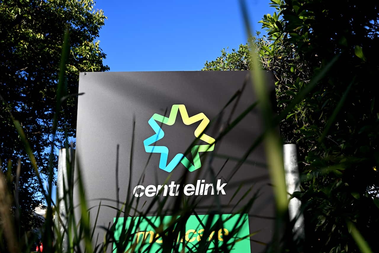 The Centrelink logo on a sign.
