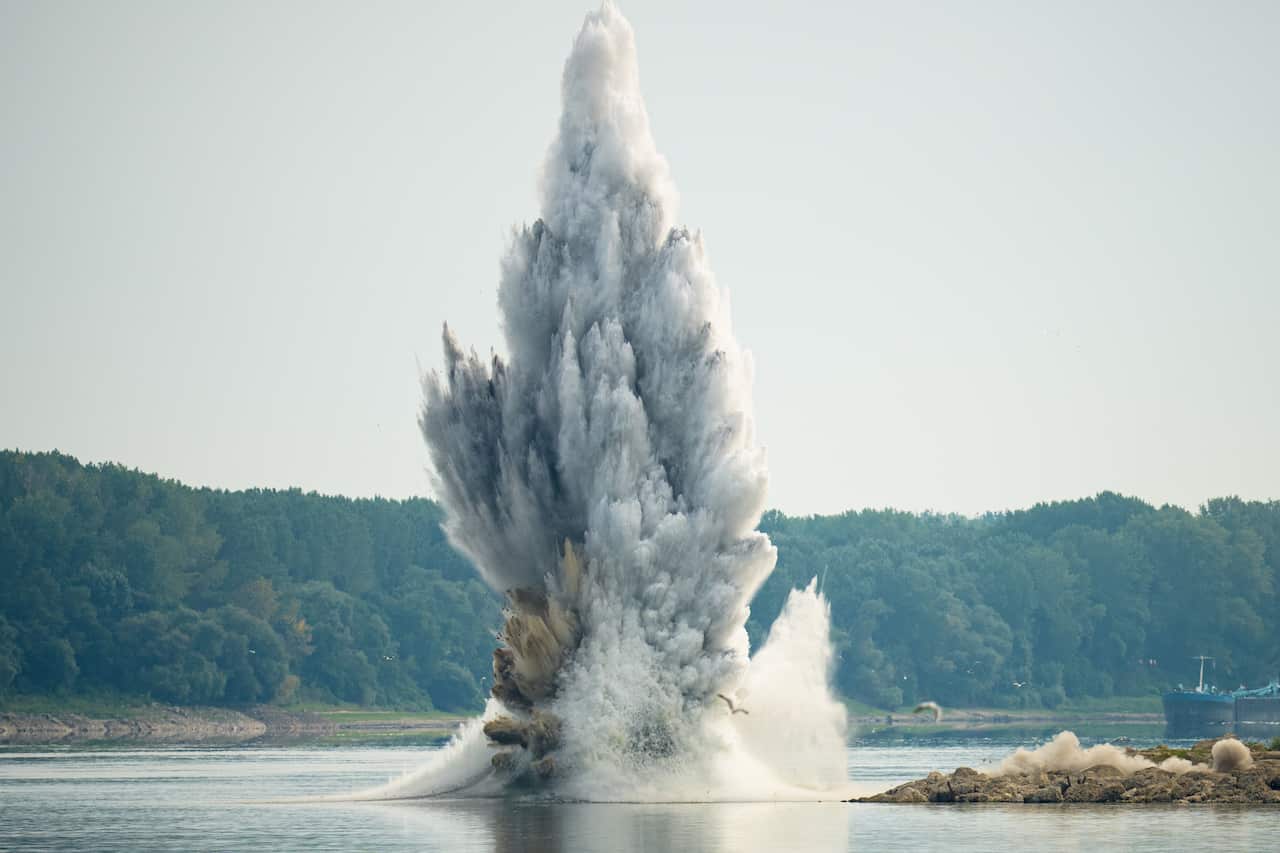 Water explodes due to an underwater detonation